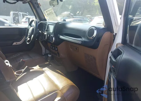 2011 Jeep Wrangler Unlimited Sahara z USA, uszkodzony, nr VIN 1J4BA5H18BL557220